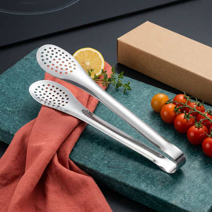 Silver kitchen tongs styled with teal and coral accents