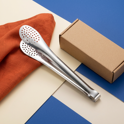 Stainless steel serving tongs flat lay with blue and orange styling